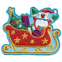 Santa sits in his red sleigh decorated with gold stars full of presents and a Christmas tree. 