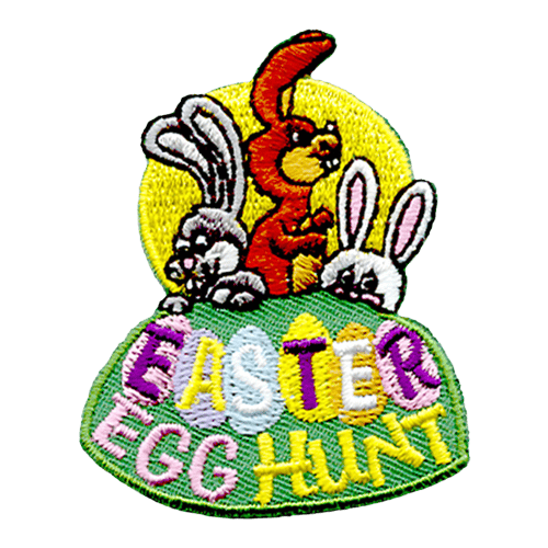 Three rabbits are poking out of a burrow. The words Easter Egg Hunt are stitched below, with the Easter inside of the eggs.