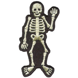 A white skeleton waves at you with his left hand. The skeleton is outlined by a black background.