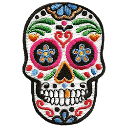 This skull is decorated in a variety of designs and colours, turning it into a sugar skull.