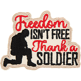 A soldier kneels next to the words Freedom Isn't Free Thank A Soldier.