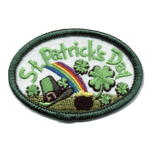 The words St. Patrick's Day are stitched in an arch at the top. Shamrocks, a rainbow, a pot of gold, and a leprechaun hat are scattered below.