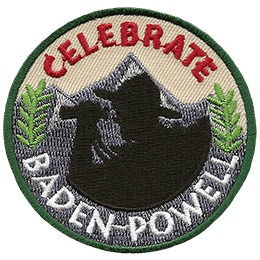 The black silhouette of Lord Baden-Powell, in his hat and with his binoculars, rests against a the background of a single mountain. Two green plants rest on either side of the shadow. The word 'Celebrate' is at the top of this circular patch and 'Baden-Powell' rests on the bottom.