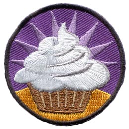 A cupcake with white frosting against a purple background.