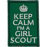 The words Keep Calm I'm A Girl Scout on a green background.