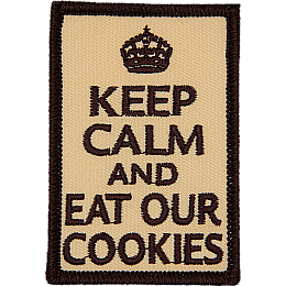 The words Keep Calm And Eat Our Cookies on a light brown background.