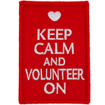The words Keep Calm And Volunteer On on a red background.