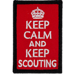 This red patch has a black merrow border. The words Keep Calm and Keep Scouting are embroidered under a white crown.