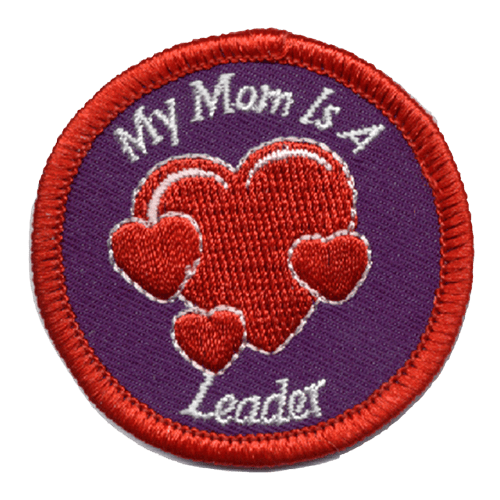 This circular patch has a thick red merrow border. The words ''My Mom Is A Leader'' circles a giant heart with three hearts around it.