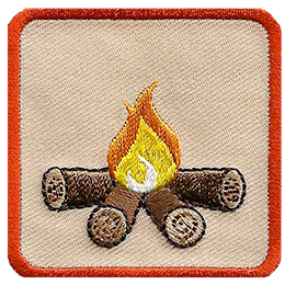 This square badge is part one of a three-part collection that displays a growing campfire. A small yellow flame burns on top of logs in this orange-bordered patch.