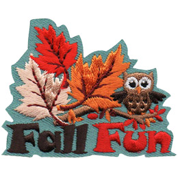 Three leaves of red, white, and gold colours start to float up off a branch, carried by the wind. A small owl sits on the branch (to the right of the leaves) as well, looking like it is about to take off. The words \'Fall Fun\' are embroidered underneath the image.