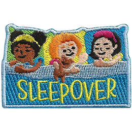 Three little girls are pretending to be asleep in bed. The word Sleepover is across the blanket.