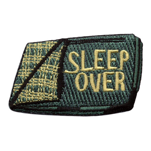 A green sleeping back with the words Sleep Over stitched on it.
