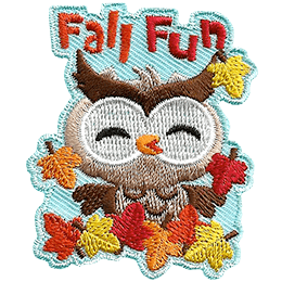 A little owl frolics in the orange, yellow, and red leaves of autumn. The words Fall Fun are above the owl's head.