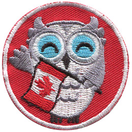 A grey and white owl holds a Canadian Flag and waves at the viewer. The background of this round patch is a bright red.