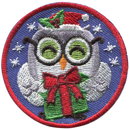A grey and white owl holds a green present box wrapped with a red ribbon and a bow. It has a Santa hat, decorated with holy berries, and a pair of black rimmed glasses. Stars sparkle in the background of this round patch.