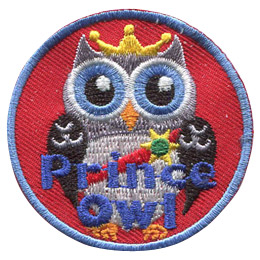 This regal prince owl wears a golden crown and a red sash pinned with a sun shaped medal.