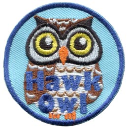 A white and brown owl with round yellow eyes. The words Hawk Owl are at the bottom.