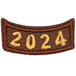 This brown rocker curves upwards like a smile. The year number 2024 is embroidered in a bold font.