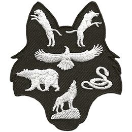 This patch is shaped like a wolf head. A panther and wolf are in the ears, a kite bird, bear, and snake rest in the middle, and a wolf on a rock sits in the snout.