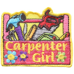 A pink carpenter tools box with the words Carpenter Girl and flowers on the front. Inside are various tools such as a saw and hammer and screwdrivers.