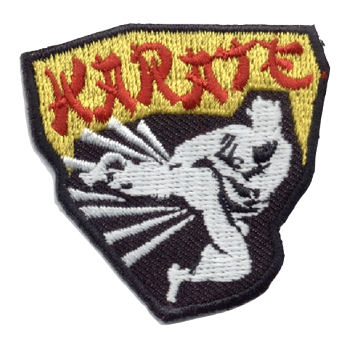 This patch depicts a white silhouette of a black belt grade karate student wearing a karate gi as he kicks out. The word Karate is written in red stylized letters at the top.
