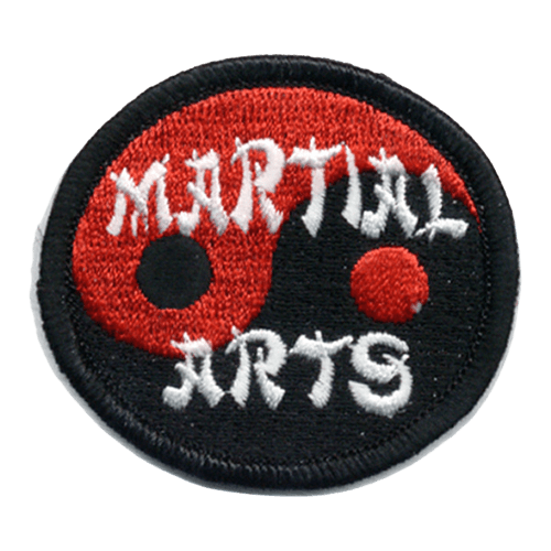 A red yin-yang symbol with the words Martial Arts stitched overtop in a white stylized font.