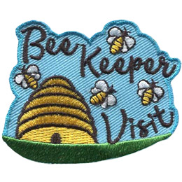 A bee hive sits on a green plain and has a sky blue background. Above and to the right of the hive are the words 'Bee Keeper Visit'. Four bees fly around both the hive and words.