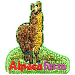 A golden brown alpaca stands on a patch of green grass. Under the alpaca are the words 'Alpaca Farm.'