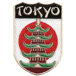 The name Tokyo is above a Pagoda in front of the flag of Japan.