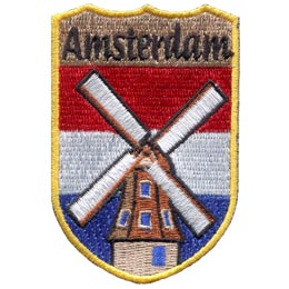 This red, white, and blue horizontal stripped patch has the word ''Amsterdam'' embroidered at the top of this shield shaped patch. A old fashioned windmill is centered over top of the stripes.