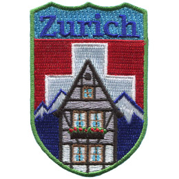 The name Zurich is above the swiss alps and the swiss flag. A chalet sits in the foreground.