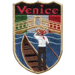 This emblem has the name 'Venice' at the top on a black background. Just below it is the green, white, and red of Italy's flag. Front and center, laid over the Italian flag, is a gondola and oarsman.