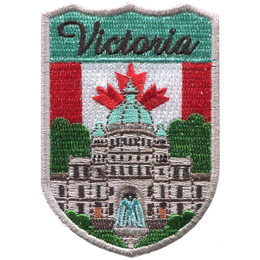 This crest displays the parliament building of British Columbia surrounded by trees. In the background is the Canadian flag and the word Victoria.