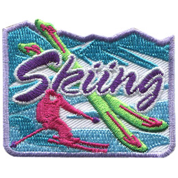 The pink silhouette of a skier goes down a mountainside. Two skis are overlapping one another in the center of the patch with the words 'Skiing' embroidered in the center.