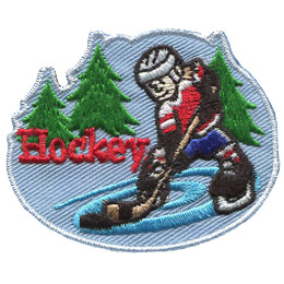 A hockey player skates on pond ice with evergreen trees in the background. The word Hockey is embroidered next to the player.