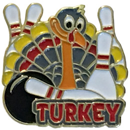 A turkey holds two bowling pins as three more pins peak out from behind its tail feathers. The word 'Turkey' sits underneath.