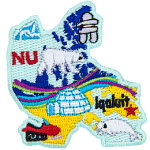 This patch is shaped like Nunavut with different symbols. Ice burg, an inukshuk, a polar bear, the aurora borealis, a snowmobile, a white beluga whale, and Iqaluit.