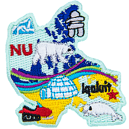 This patch is shaped like Nunavut with different symbols. Ice burg, an inukshuk, a polar bear, the aurora borealis, a snowmobile, a white beluga whale, and Iqaluit.