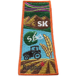 This patch is in the shape of the Canadian province of Saskatchewan with symbols such as the northern lights, grasslands, mountains, prairies, a tractor and a football helmet.