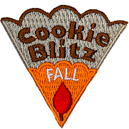 The words Cookie Blitz Fall are stitched on a cookie slice with orange icing and a red leaf.