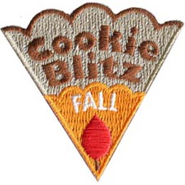 The words Cookie Blitz Fall are stitched on a cookie slice with orange icing and a red leaf.