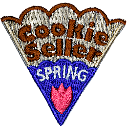 The words Cookie Seller Spring are on a cookie slice with blue icing and a pink flower.