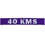 The number 40 KMS is stitched in white on a purple background.