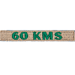 The number 60 KMS is stitched in green on a cream-coloured background.
