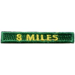 The words 8 Miles are stitched in yellow on a green background.