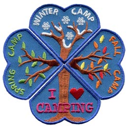 Four heart shaped patches are placed so they form a four-leaf clover. The bottom most heart contains the trunk of a tree with the words 'I Love Camping'. The left heart is pictured with two tree branches beginning to bud. The words 'Spring Camp' is embroidered on it. The top heart has snowflakes and snow covered tree branches. The words 'Winter Camp' are embroidered on the patch. The right heart has the words 'Fall Camp' and pictures tree branches that are loosing their leaves.