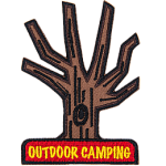A tree without leaves, with the words Outdoor Camping, stitched in yellow on a red rectangle at the bottom.