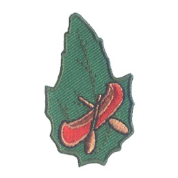 A red canoe with wooden oars on a green leaf.